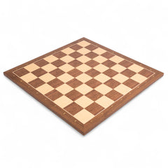Wooden chess board with checkered pattern on a white background