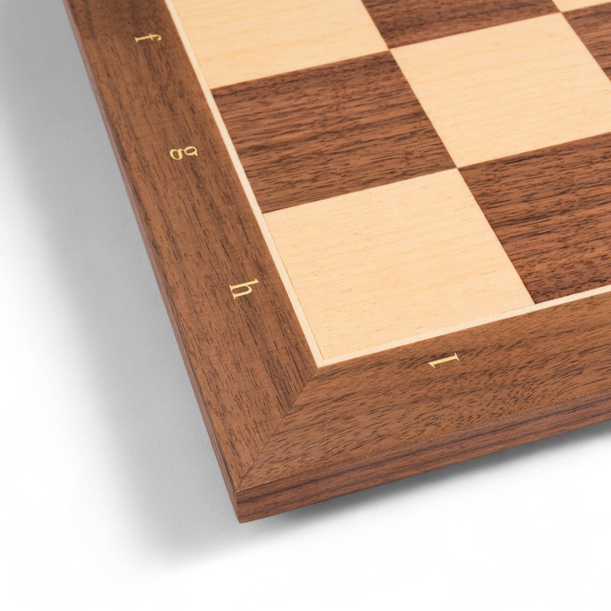 Wooden chessboard with checkered pattern on a white background