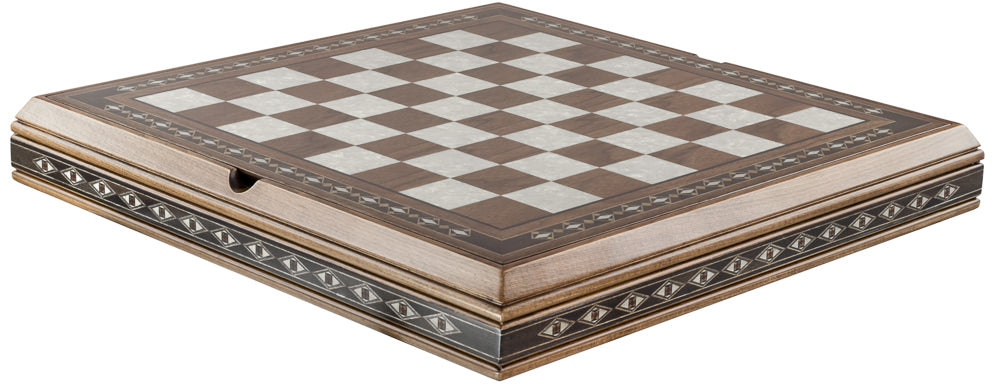 A polished wooden chess board with a checkered pattern, featuring eco mother of pearl details on the edges which contains storage for chess pieces below.
