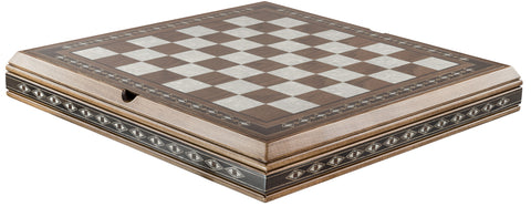 A polished wooden chess board with a checkered pattern, featuring eco mother of pearl details on the edges which contains storage for chess pieces below.