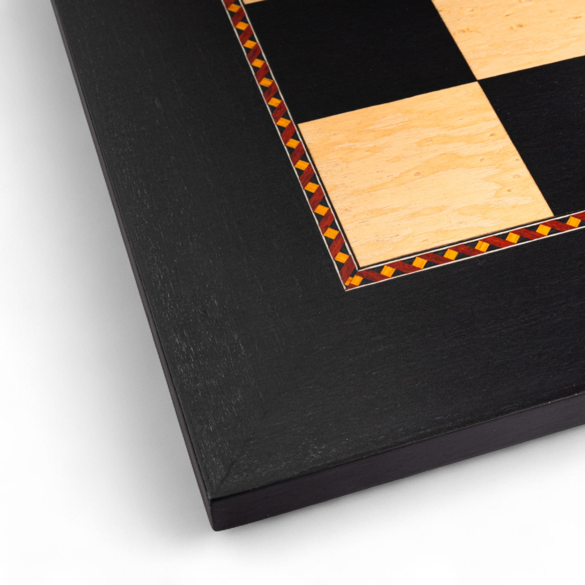 Close-up of a black and wooden checkered board corner