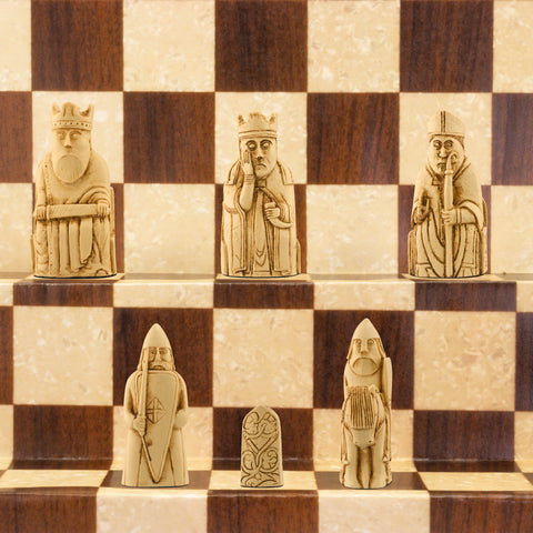 A handmade recreation of The Isle of Lewis Chess Set, the oldest known chess set.

In 1831 the sea carried away a sandbank on the Isle of Lewis uncovering a mysterious building that had been buried under the sand. A peasant working nearby found what he concluded to be a collection of Elves and Gnomes. The superstitious highlander flung down his spade and fled home in horror.