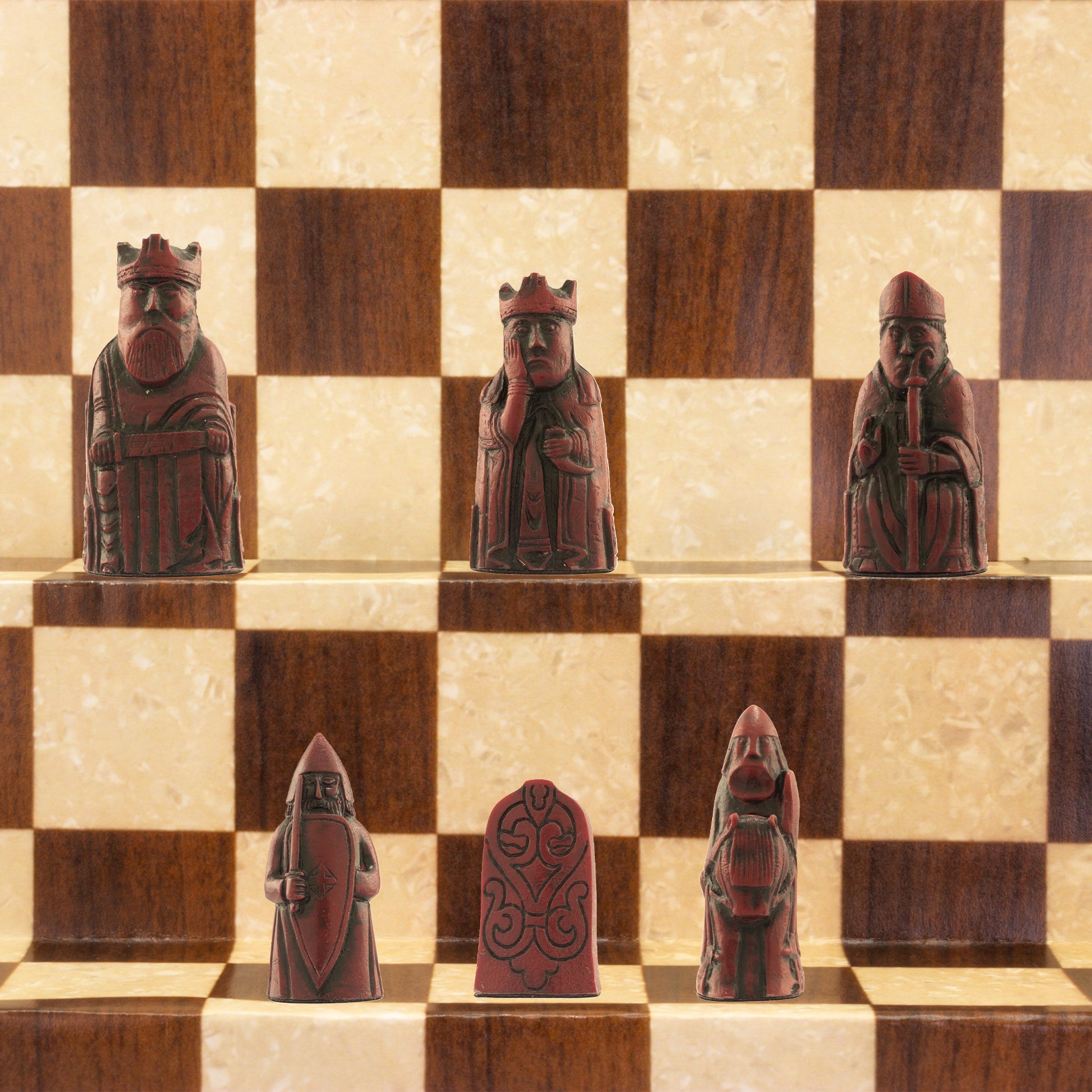 A miniature chess set inspired by the Isle of Lewis chessmen, the oldest known chess set.

In 1831 the sea carried away a sandbank on the Isle of Lewis uncovering a mysterious building that had been buried under the sand. A peasant working nearby found what he concluded to be a collection of Elves and Gnomes. The superstitious highlander flung down his spade and fled home in horror.