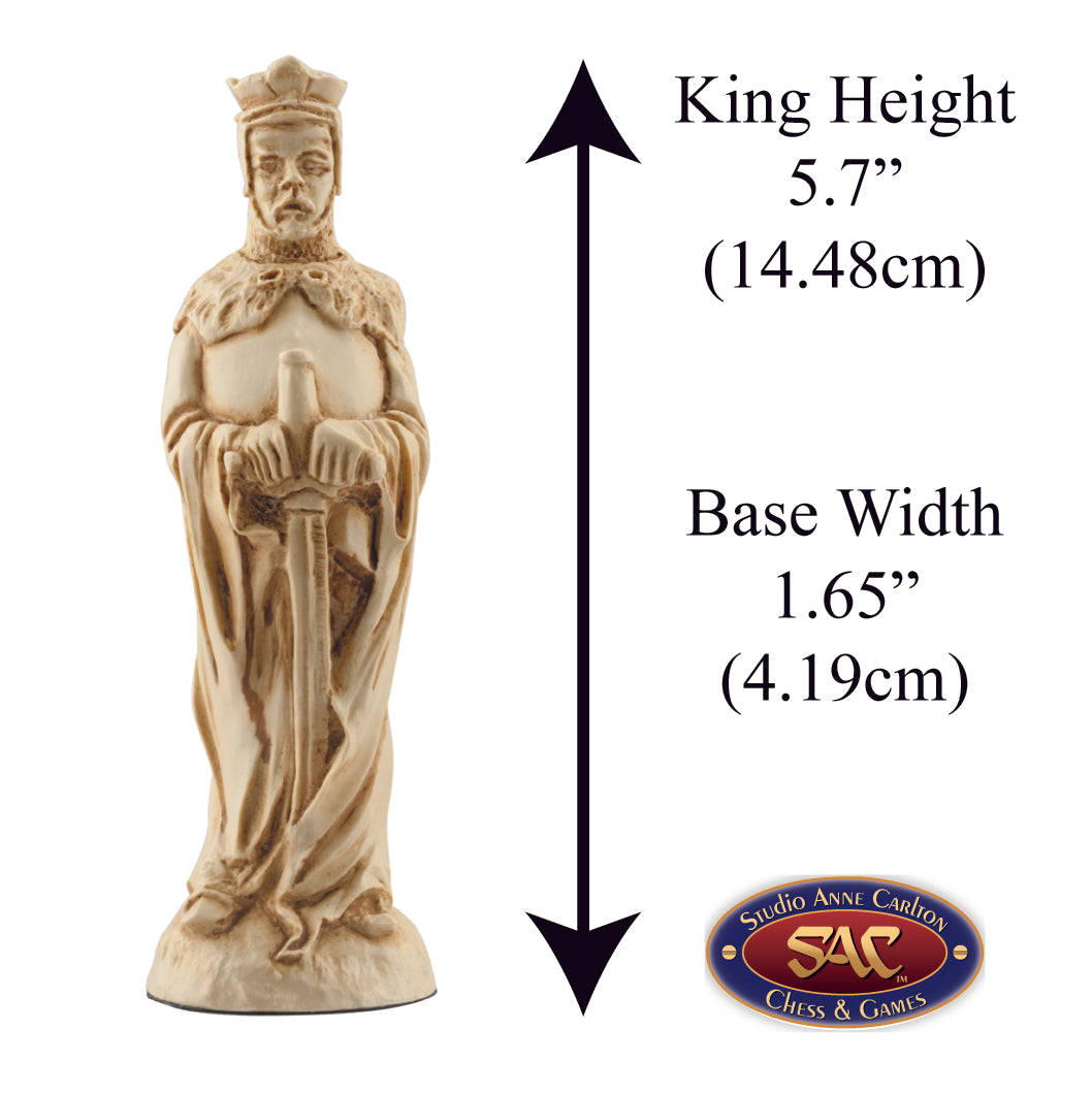 A handmade ivory coloured chess piece depicting King Arthur, From Arthurian Legend, Alongside measurement information.