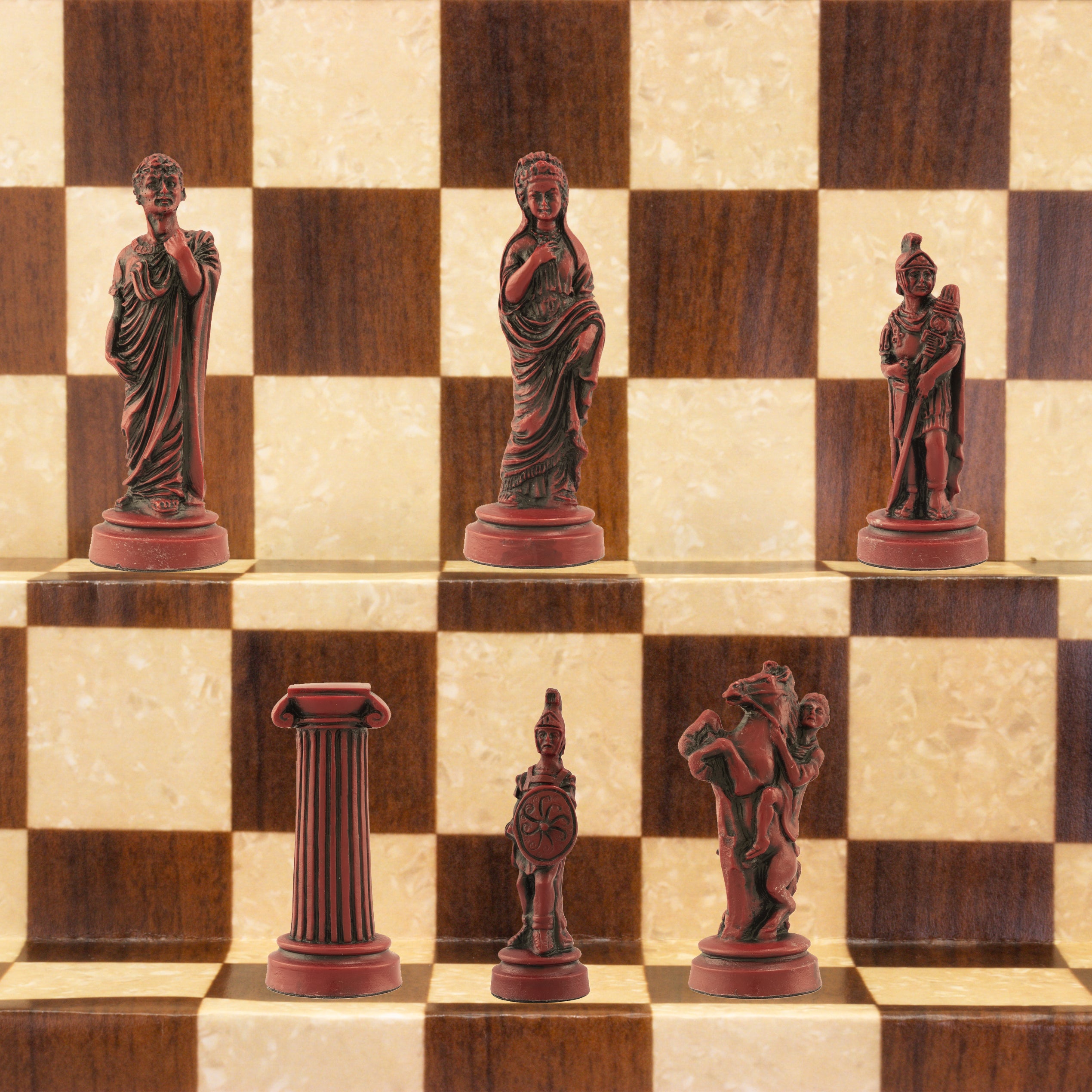 The burgundy coloured side of a handmade chess set depicting Roman era figures, displayed on a wooden chess board.