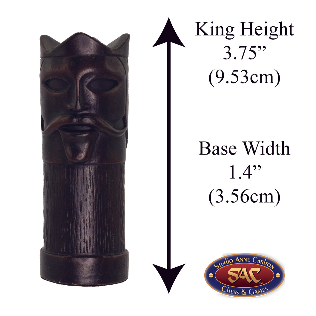 A hand made black coloured King chess piece inspired by a fusion of traditional staunton chess piece design and medieval masquerades.

Alongside measurement information.