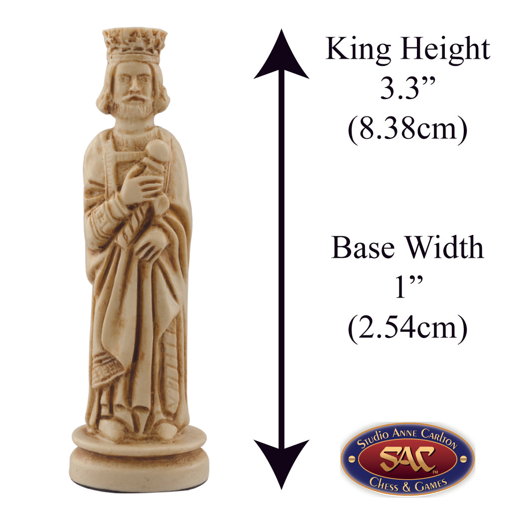 A hand made ivory coloured chess piece depicting a King wearing clothing faithful to a typical western european court in the Middle Ages, Alongside measurement information.