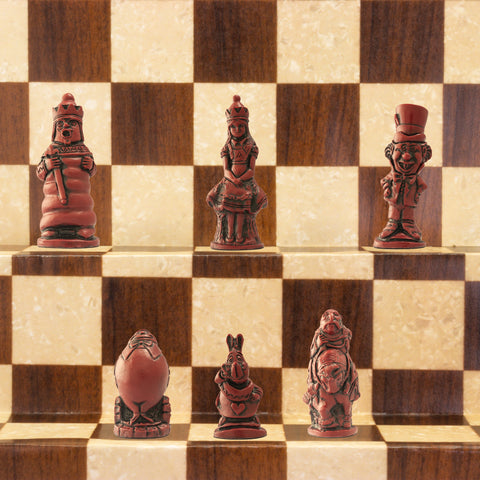 A handmade chess set featuring characters from Alice in Wonderland, placed on a checkered background.