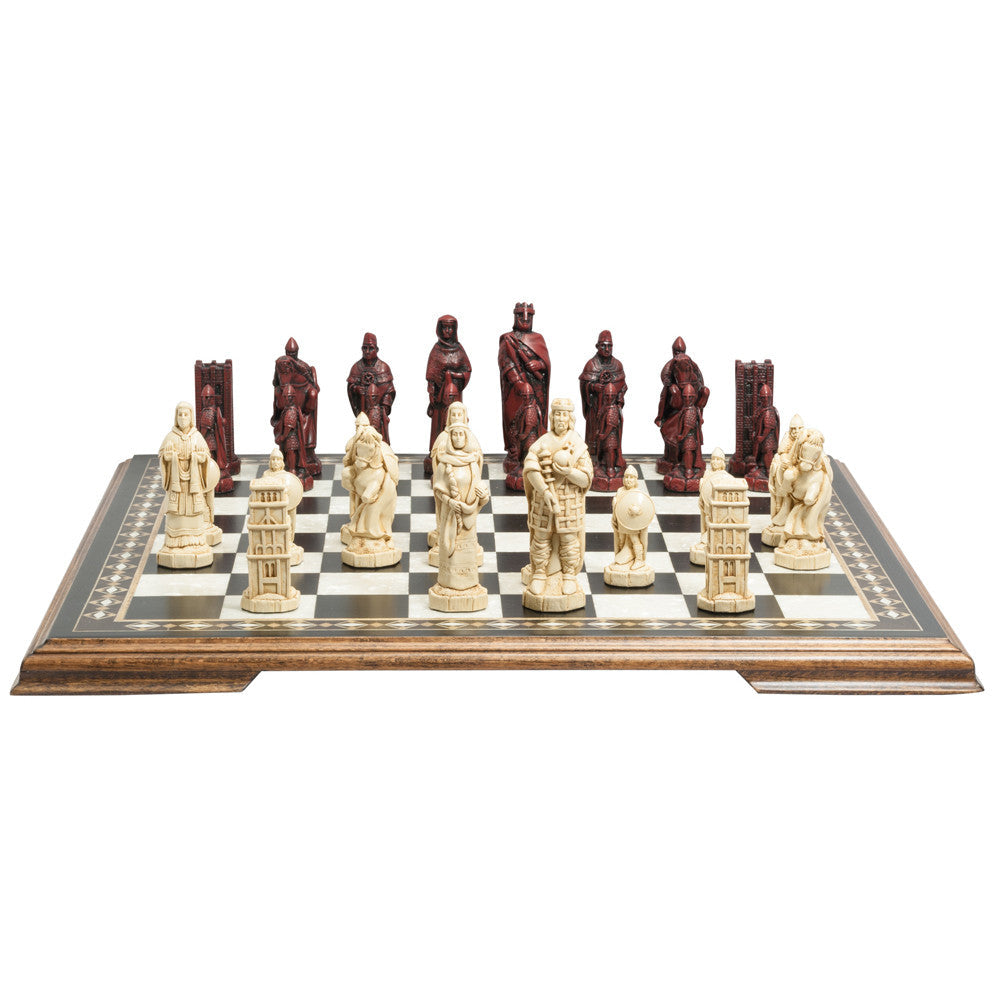 A handmade chess set depicting characters from the Battle of Hastings, with pieces representing King Harold II of England, Edith Swan-Neck, Archbishop Stigand, William the Conqueror, and other Saxon and Norman figures, placed on a checkered background.