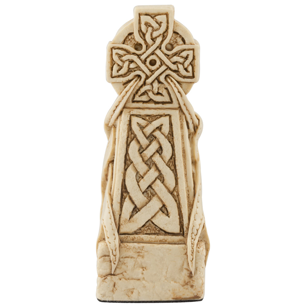 A handmade chess piece featuring a Celtic Cross.
