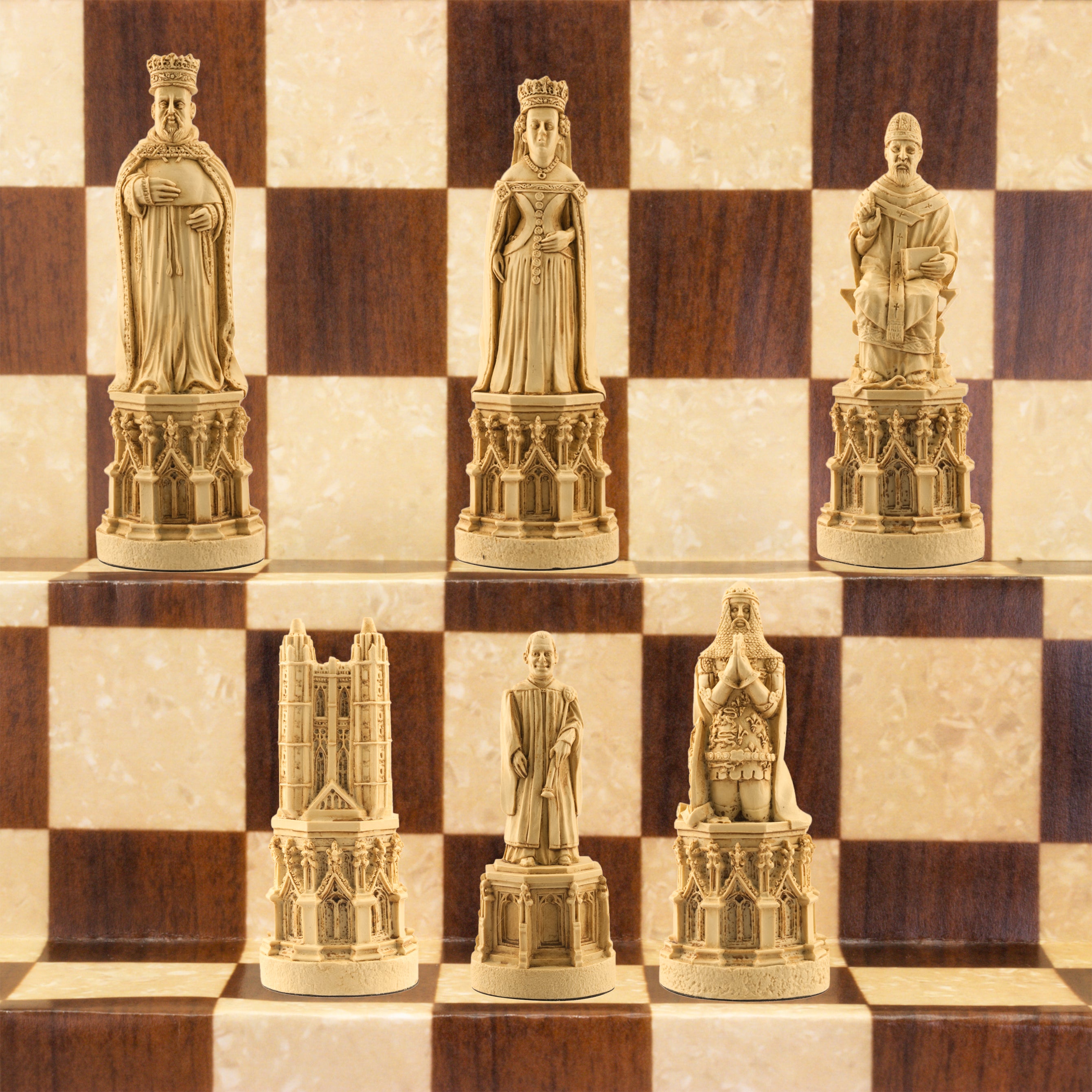 The ivory coloured side of a hand made chess set inspired by the architecture and statuary in and around Medieval Cathedrals, a chess set of gracious proportions and great detail.