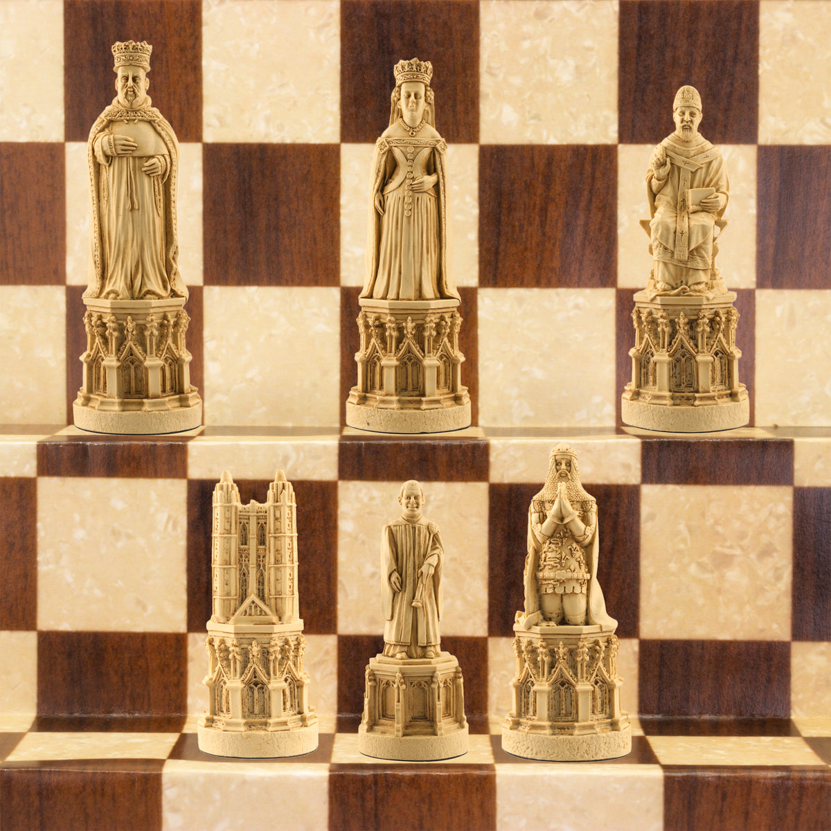 The ivory coloured side of a hand made chess set inspired by the architecture and statuary in and around Medieval Cathedrals, a chess set of gracious proportions and great detail.