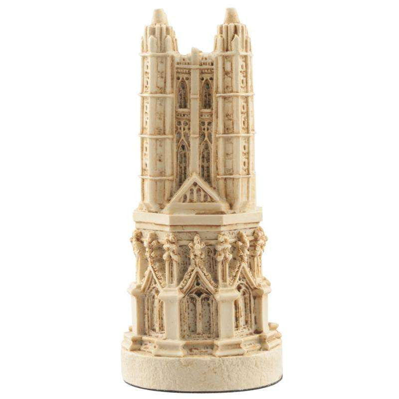A handmade ivory coloured chess piece depicting a magnificent bell tower, typically found in most cathedrals.