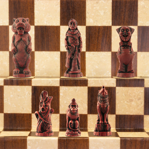 A handmade chess set featuring characters from 'The Wonderful Wizard of Oz' by L. Frank Baum, placed on a wooden chess board.