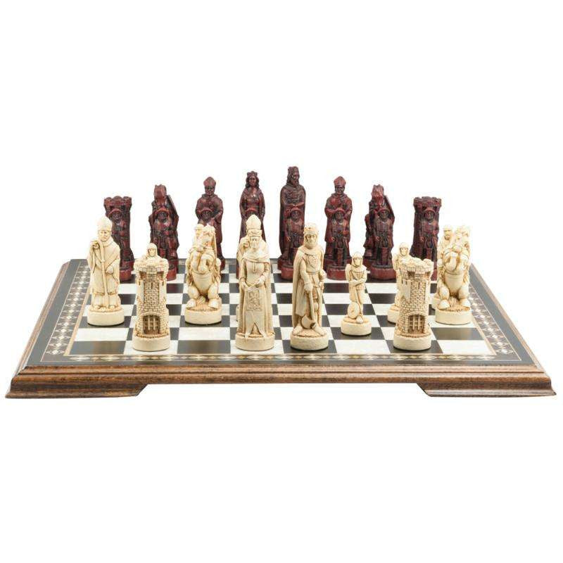 A handmade chess set depicting figures from the Battle of Bannockburn, on a chess board. The set includes a king, a queen, a bishop, a knight, and a rook, all in ivory and burgundy colours.