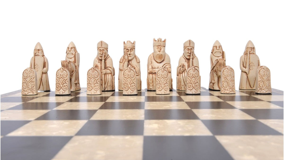 A handmade recreation of The Isle of Lewis Chess Set, the oldest known chess set.

In 1831 the sea carried away a sandbank on the Isle of Lewis uncovering a mysterious building that had been buried under the sand. A peasant working nearby found what he concluded to be a collection of Elves and Gnomes. The superstitious highlander flung down his spade and fled home in horror.