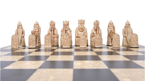 A handmade recreation of The Isle of Lewis Chess Set, the oldest known chess set.

In 1831 the sea carried away a sandbank on the Isle of Lewis uncovering a mysterious building that had been buried under the sand. A peasant working nearby found what he concluded to be a collection of Elves and Gnomes. The superstitious highlander flung down his spade and fled home in horror.
