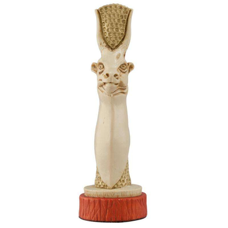 A handmade chess piece depicting Hesat, the ancient goddess often depicted as a cow, embodying nourishment, fertility and motherhood.