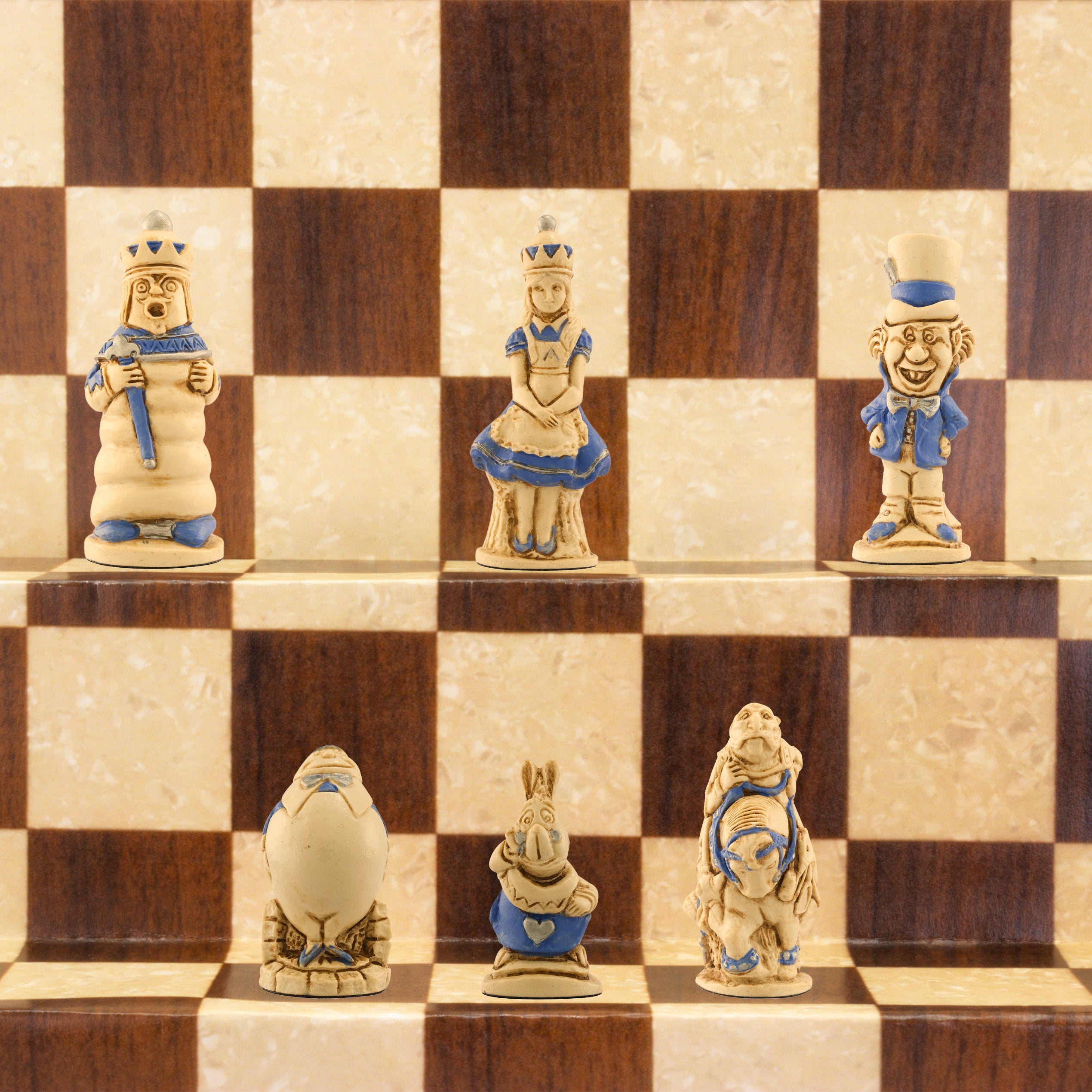 A handmade chess set featuring characters from Alice in Wonderland, placed on a checkered background.