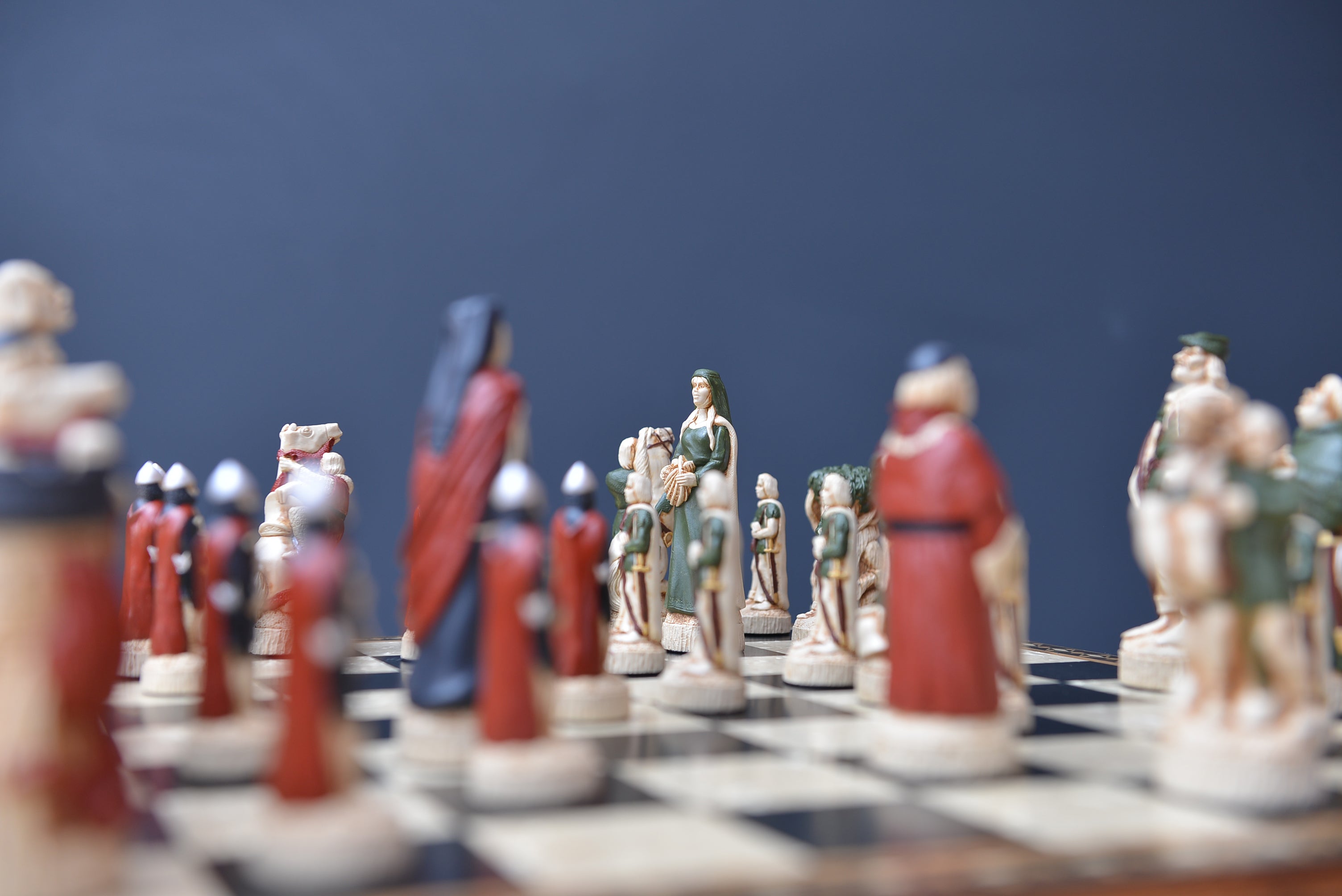 A lifestyle shot showcasing a hand painted themed chess set, inspired by the legend surrounding Robin Hood. 