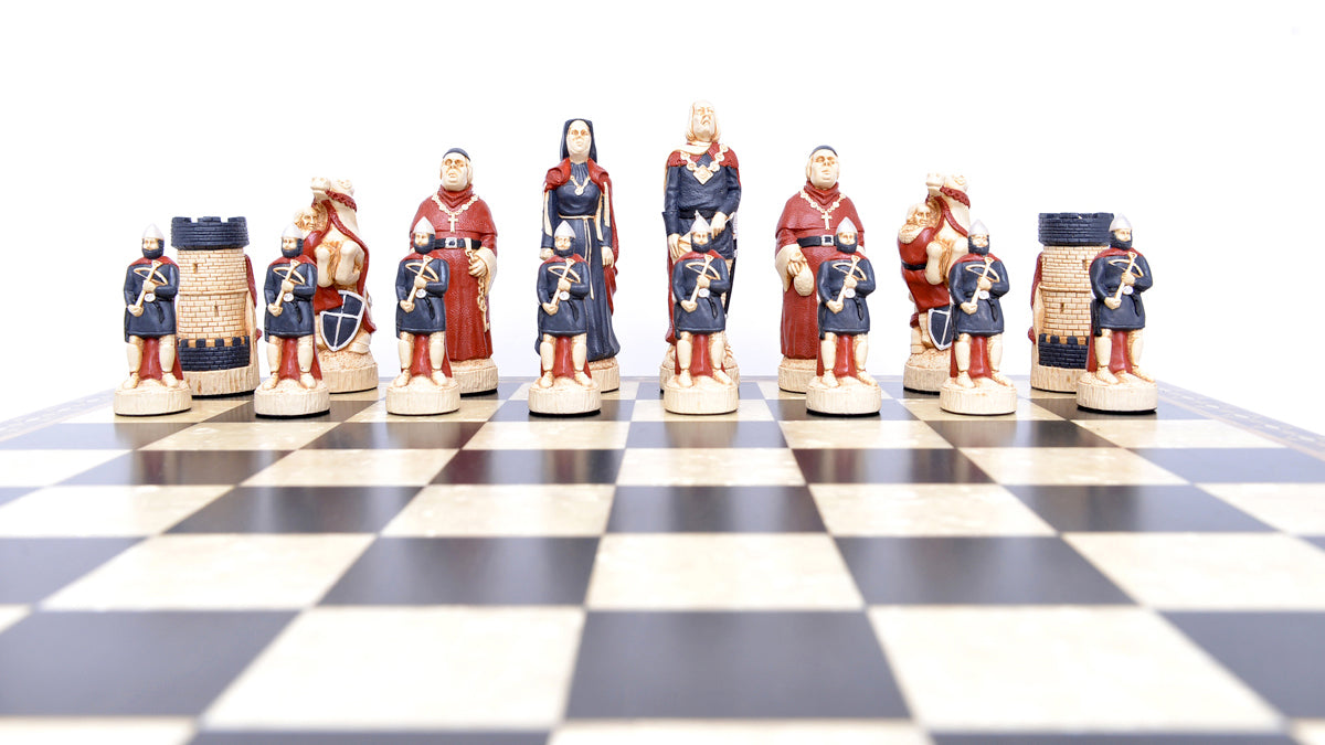 One side of a hand painted themed chess set, inspired by the legend surrounding Robin Hood. This side contains The Sherrif of Nottingham as the King, a prioress as the Queen, The Abbot of St Mary's as the Bishop, Sir Guy as the Knight, The Keep of Nottingham Castle as the Rook, and Soldiers of the Sherrif as the pawns.
These pieces are displayed atop a black and white wooden chessboard.