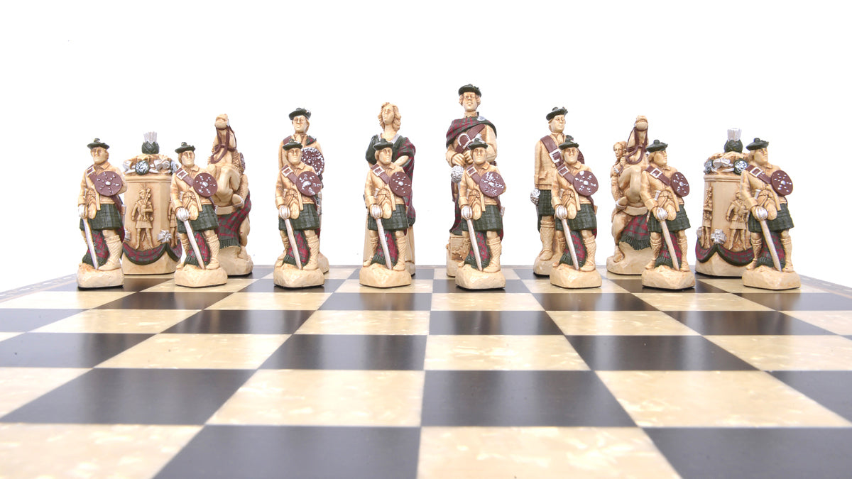 A hand-painted chess set featuring historical figures, with pieces arranged on a chess board.