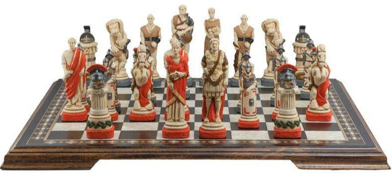 Hand painted chess set featuring characters resembling Spartacus and other figures, placed on a wooden chessboard.