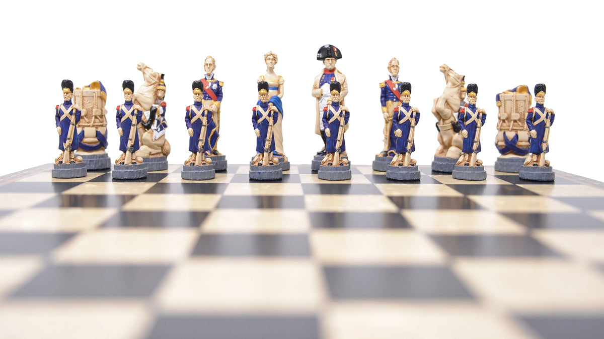 A hand made chess set depicting characters from the Battle of Waterloo, placed on a chess board.