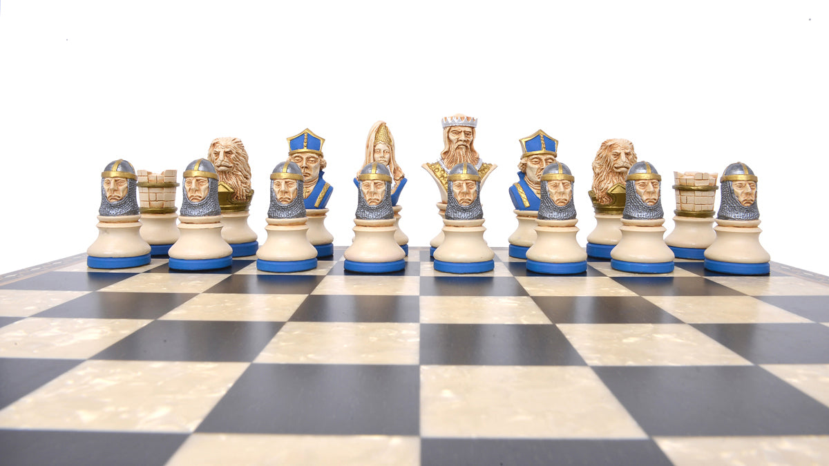 The blue coloured side of a hand painted themed chess set, designed with a blend of the classic styles of Staunton and the Old French Dieppe, featuring characters such as Richard I as the King, Elanor of Aquitaine as the Queen, Hubert Walder as the Bishop, A Lion as the Knight, and William Marshall as the Pawn.

Placed upon on a black and white wooden chessboard.