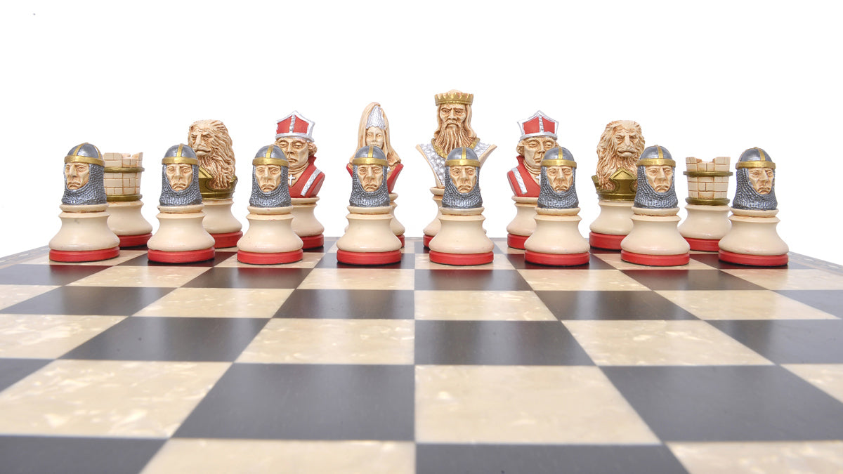 The red coloured side of a hand painted themed chess set, designed with a blend of the classic styles of Staunton and the Old French Dieppe, featuring characters such as Richard I as the King, Elanor of Aquitaine as the Queen, Hubert Walder as the Bishop, A Lion as the Knight, and William Marshall as the Pawn.

Placed upon on a black and white wooden chessboard.