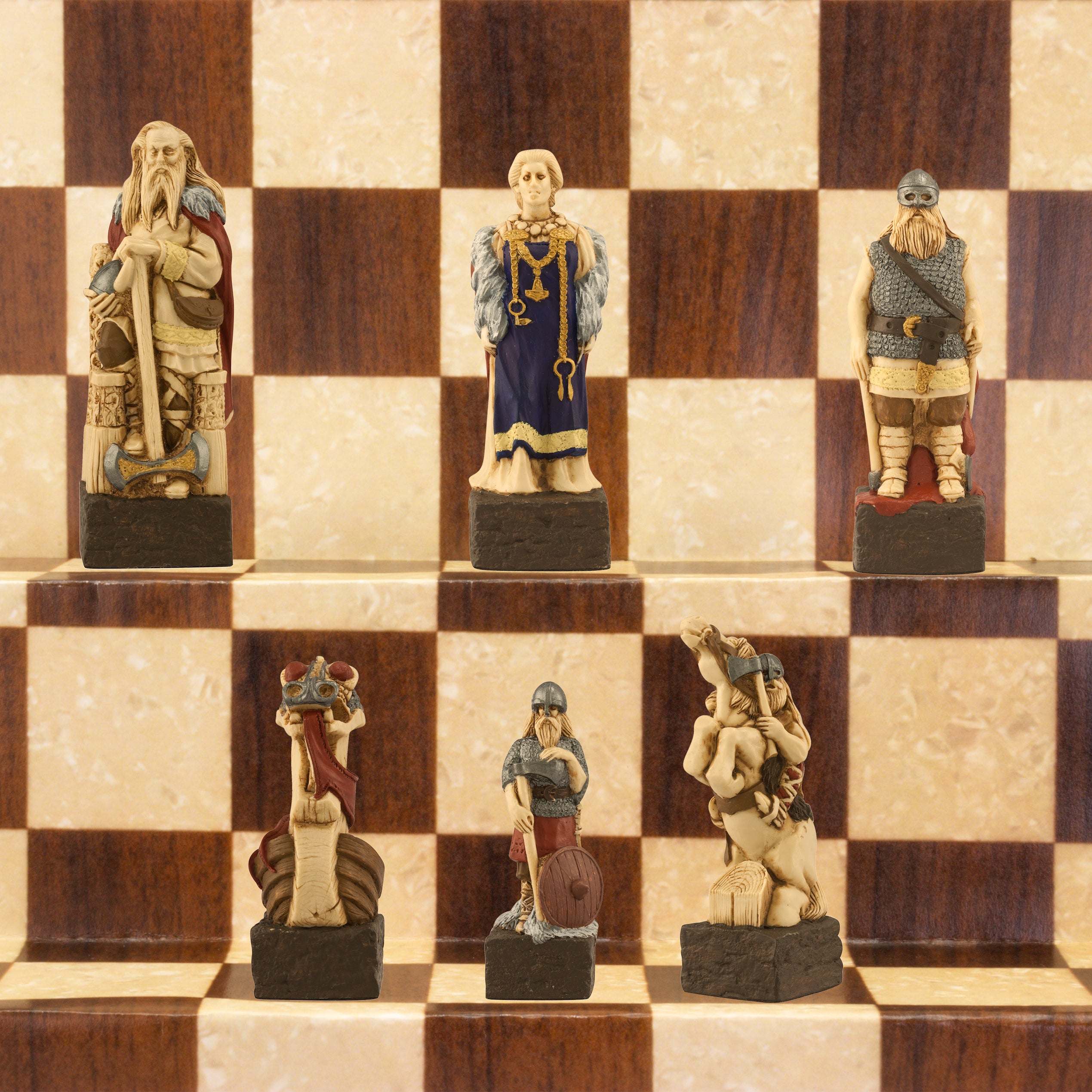 A close-up of a handmade chess set with pieces designed in Viking styles, set up on a wooden chess board.