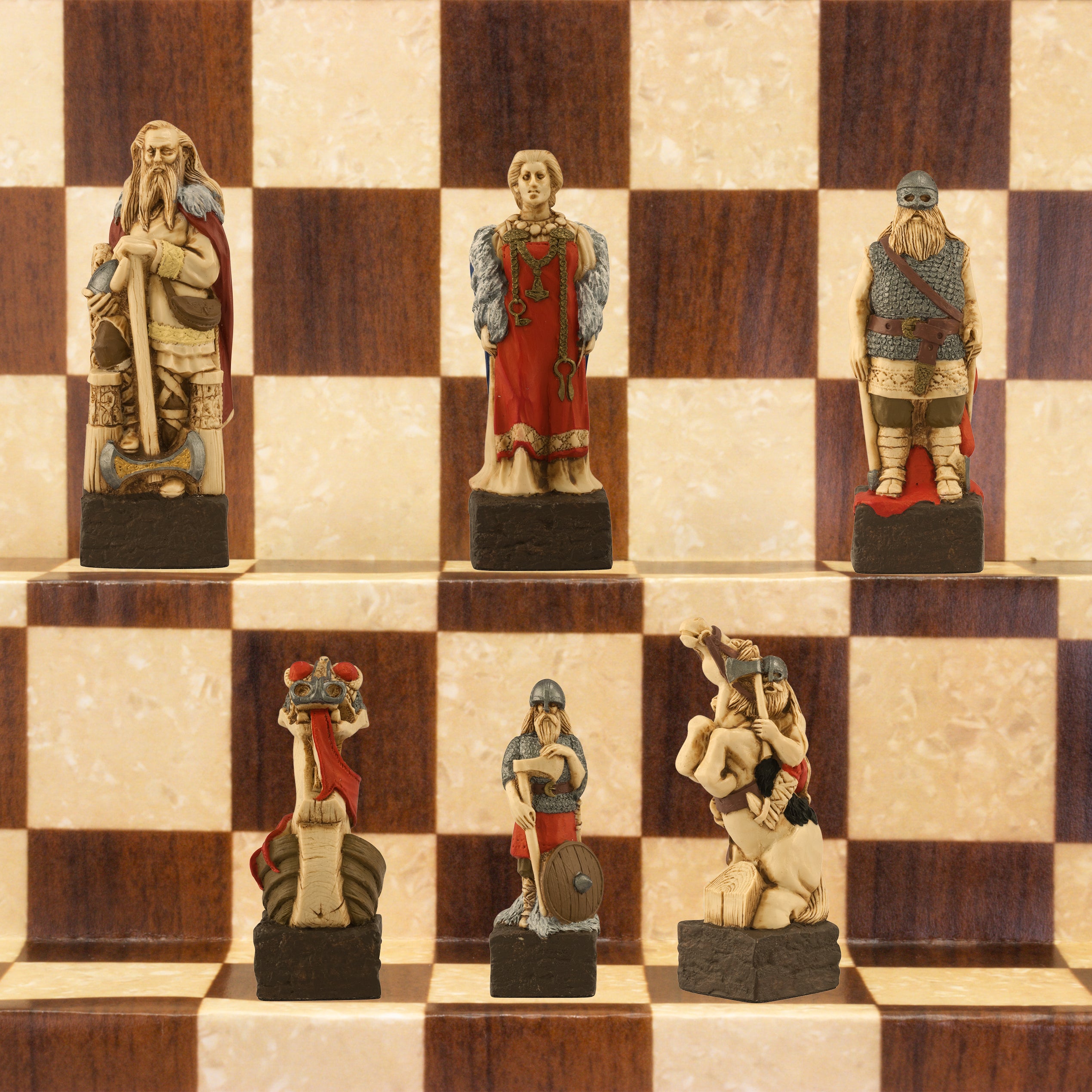 A close-up of a handmade chess set with pieces designed in Viking styles, set up on a wooden chess board.