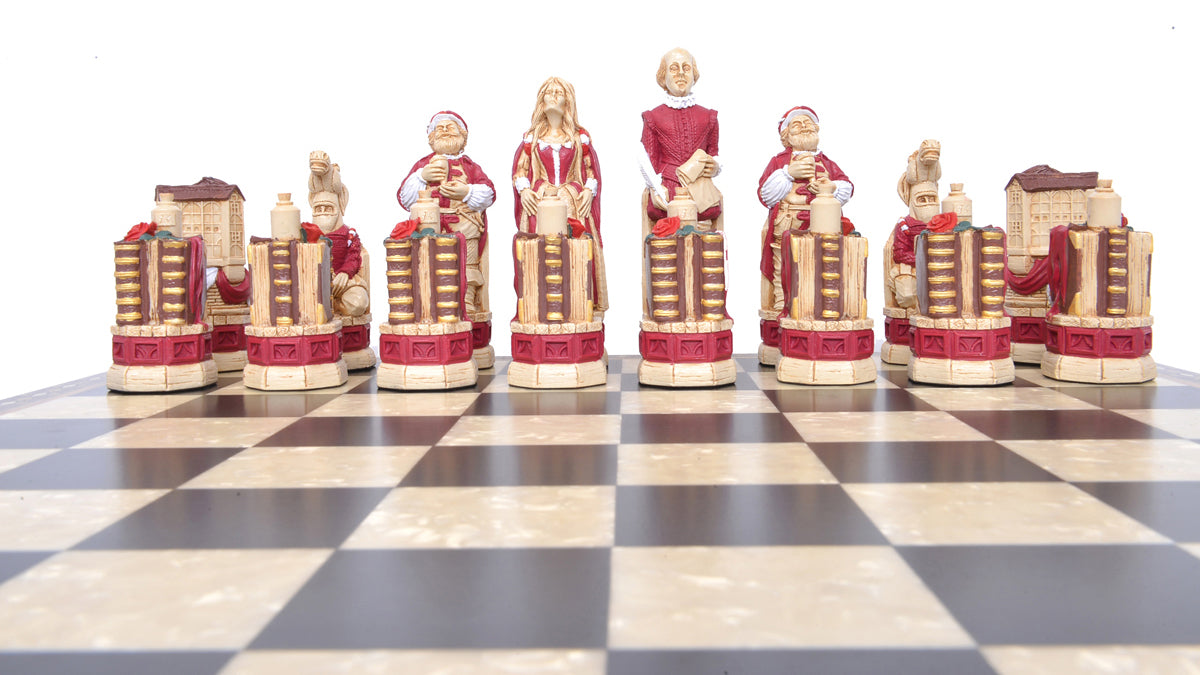 A lifestyle shot of the red coloured side of a handmade and hand painted chess set depicting Shakespeare, Lady Macbeth, Sir John Fallstaff, Nick bottom & The Globe theatre displayed on a wooden chess board.