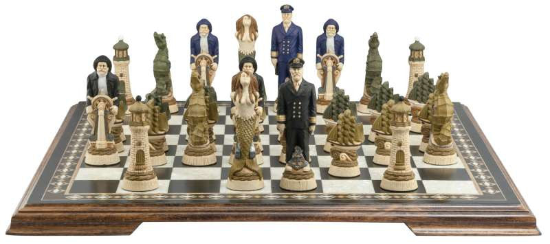 A nautical-themed hand painted chess set with pieces including a Captain, Mermaid, Navigator, Seahorse, Lighthouse, and Ship, displayed on a black and white chess board.