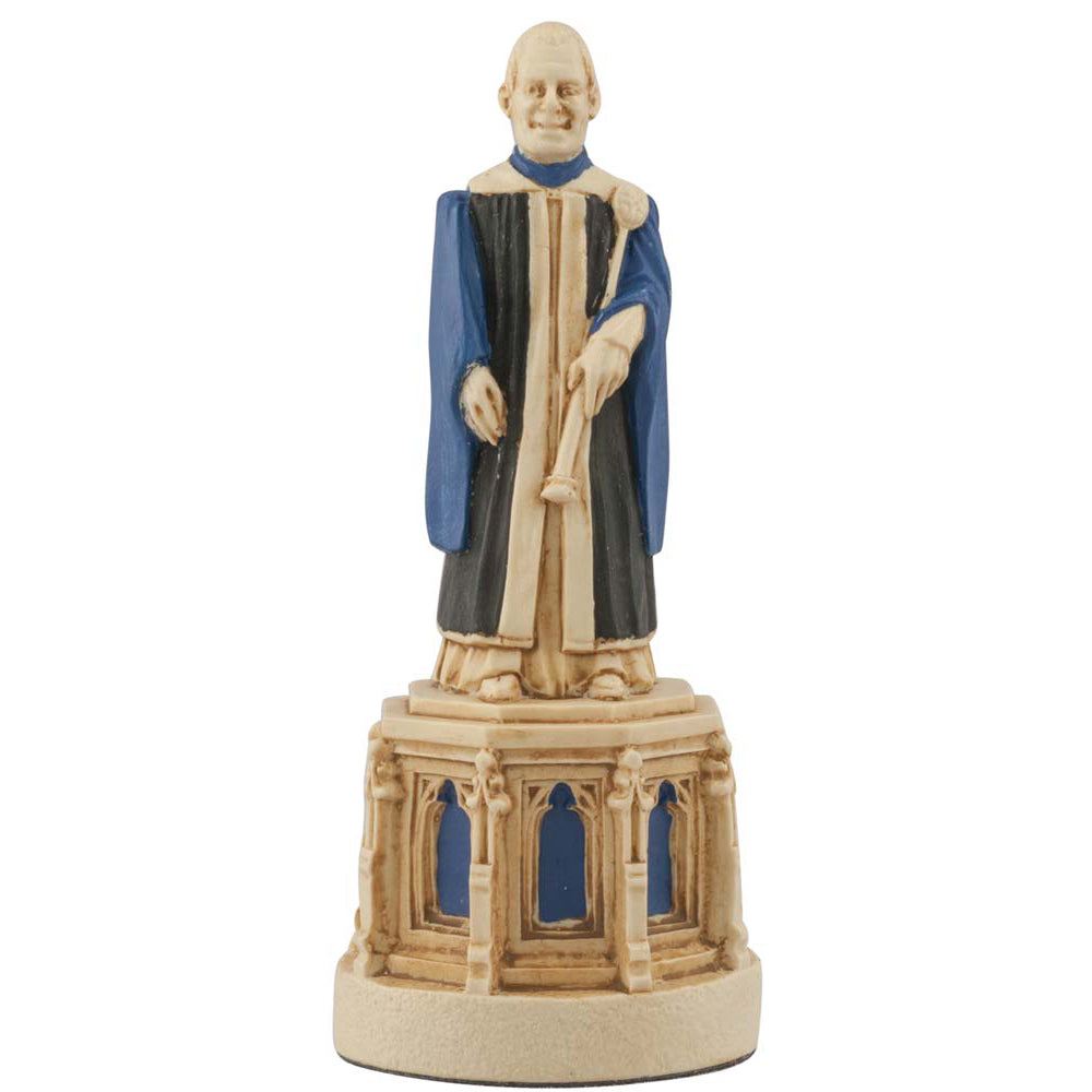 A hand painted cream base, blue accented chess piece depicting a Cathedral Verger, The Vergers look after the daily life, liturgical preprations and the security of the Cathedral.