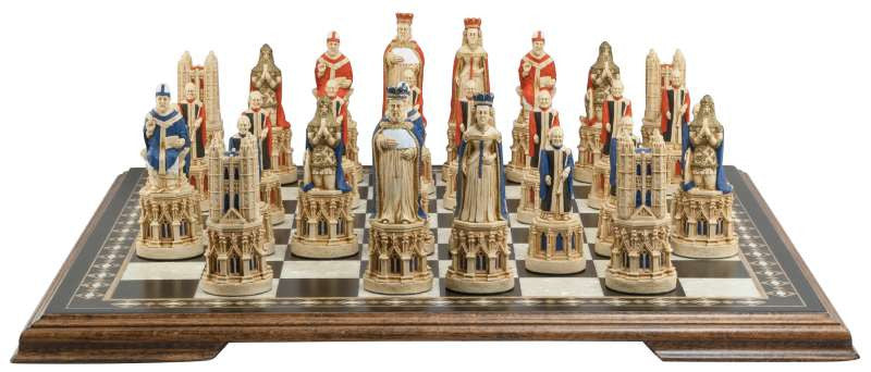 A hand painted chess set inspired by the architecture and statuary in and around Medieval Cathedrals, placed on a chess board.

A chess set of gracious proportions and great detail.
