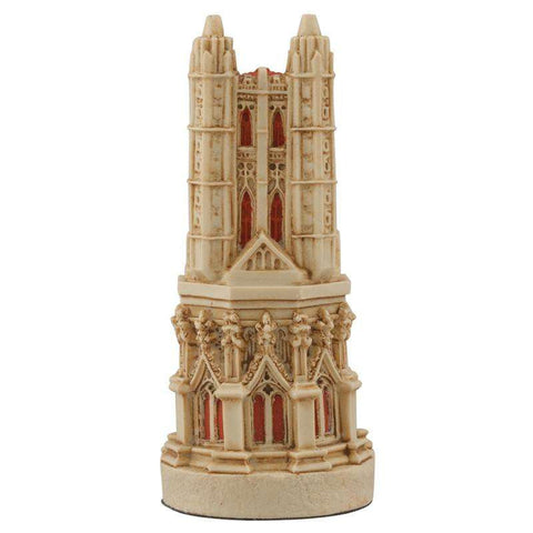 A hand painted cream base, red accented chess piece depicting a magnificent bell tower, typically found in most cathedrals.