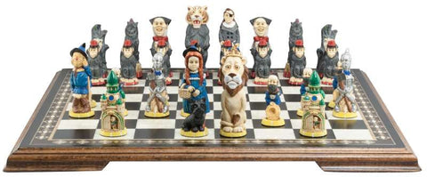 Hand Painted chess set featuring characters resembling Dorothy and other characters from the Wonderful Wizard of Oz, placed on a wooden chessboard.