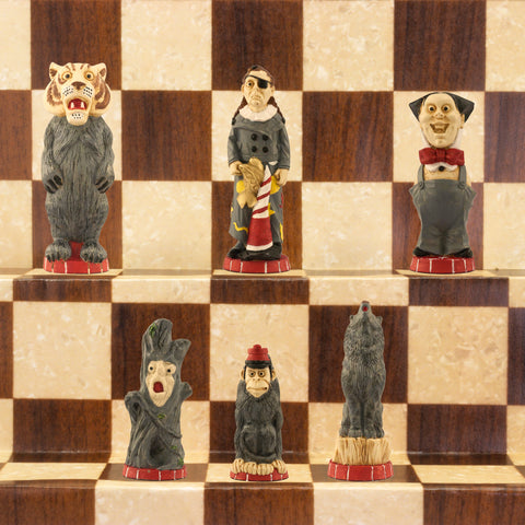 Hand-painted chess pieces featuring characters from 'The Wonderful Wizard of Oz', placed on a chess board.