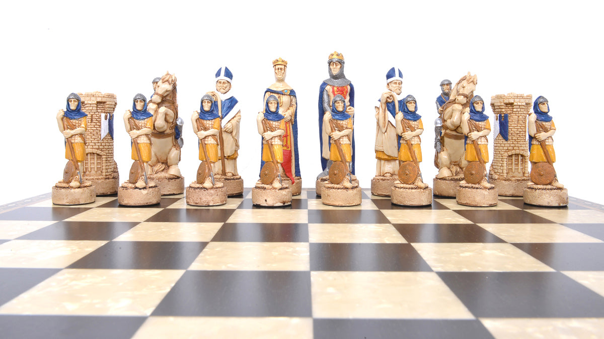 Hand-painted chess pieces depicting characters from the Battle of Bannockburn, placed on a chessboard.