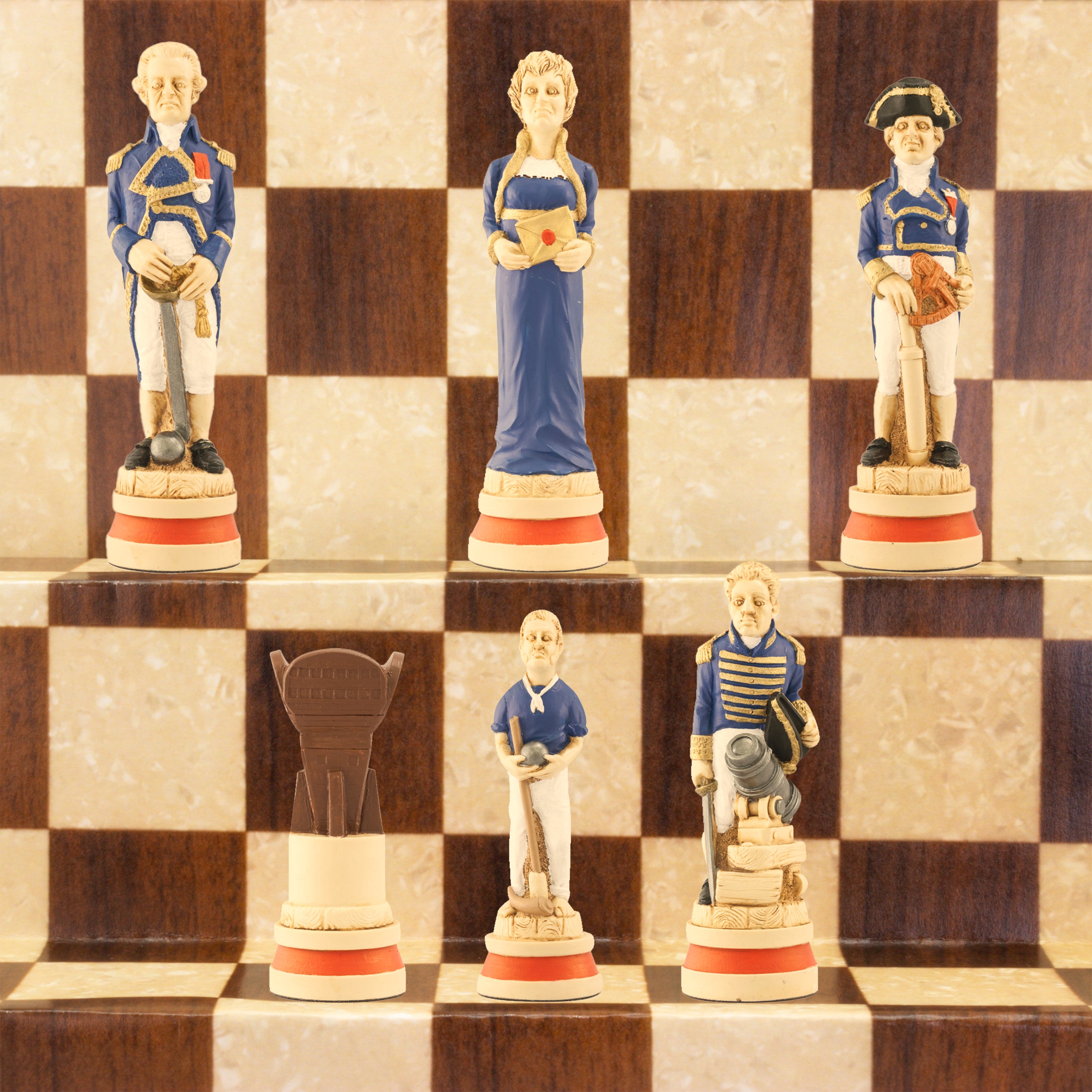 A hand-painted chess set depicting characters related to the Battle of Trafalgar, with a blue and red colour scheme, displayed on a chessboard.