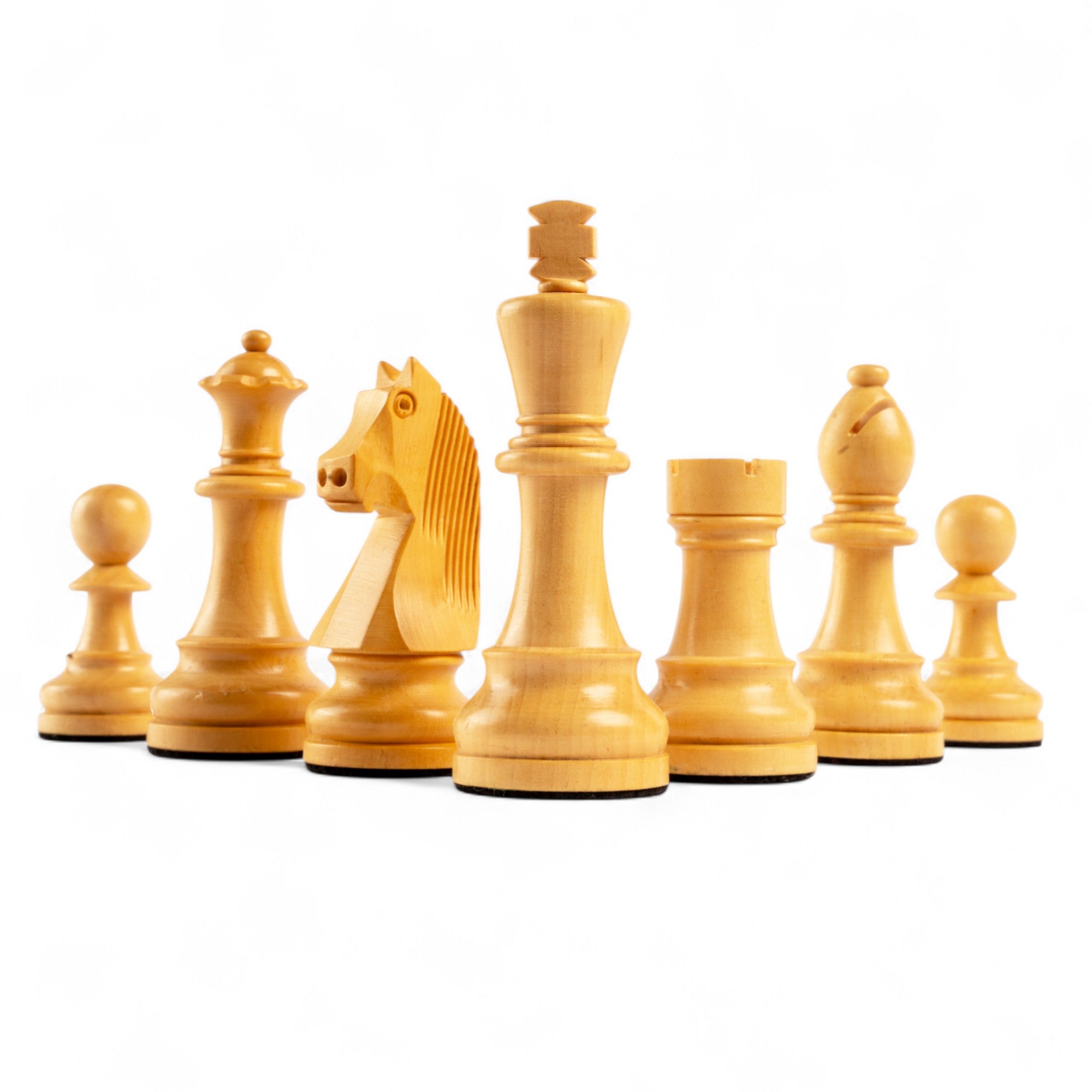 Set of wooden chess pieces on a white background