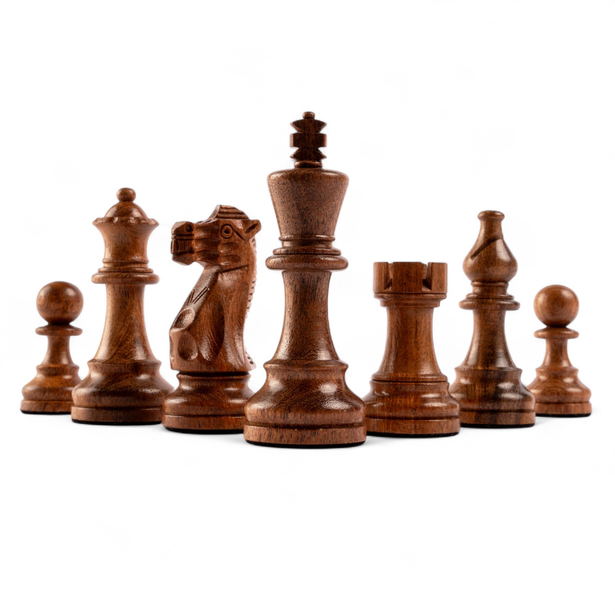 Set of wooden chess pieces on a white background