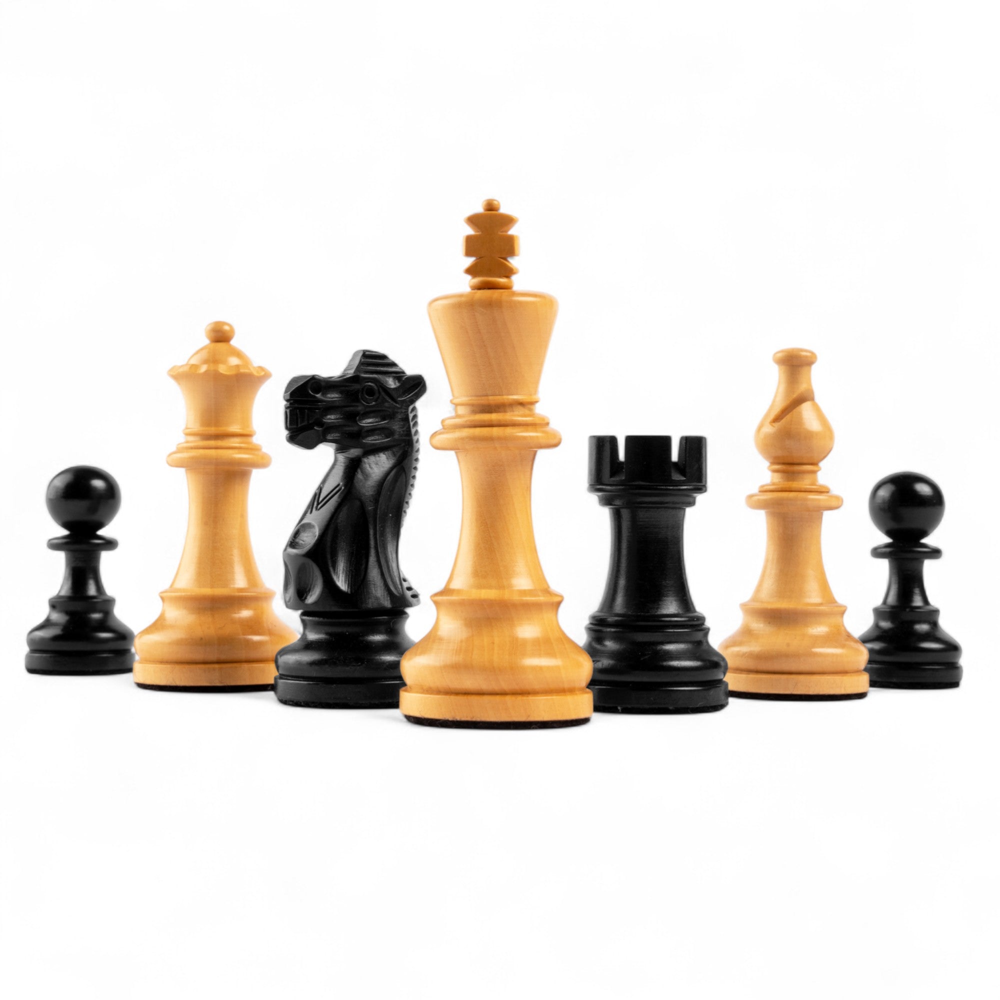 Set of wooden chess pieces on a white background