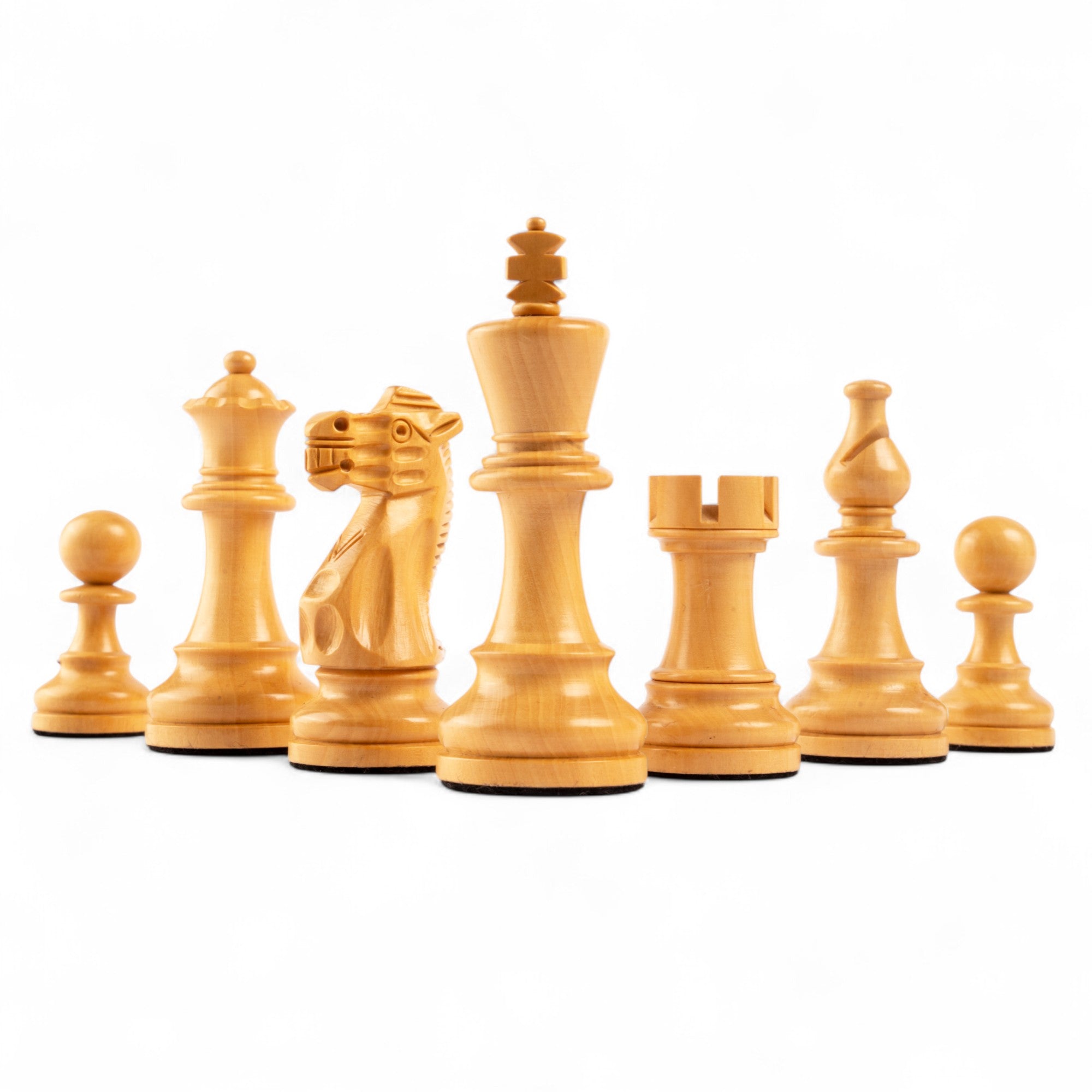 Set of wooden chess pieces on a white background