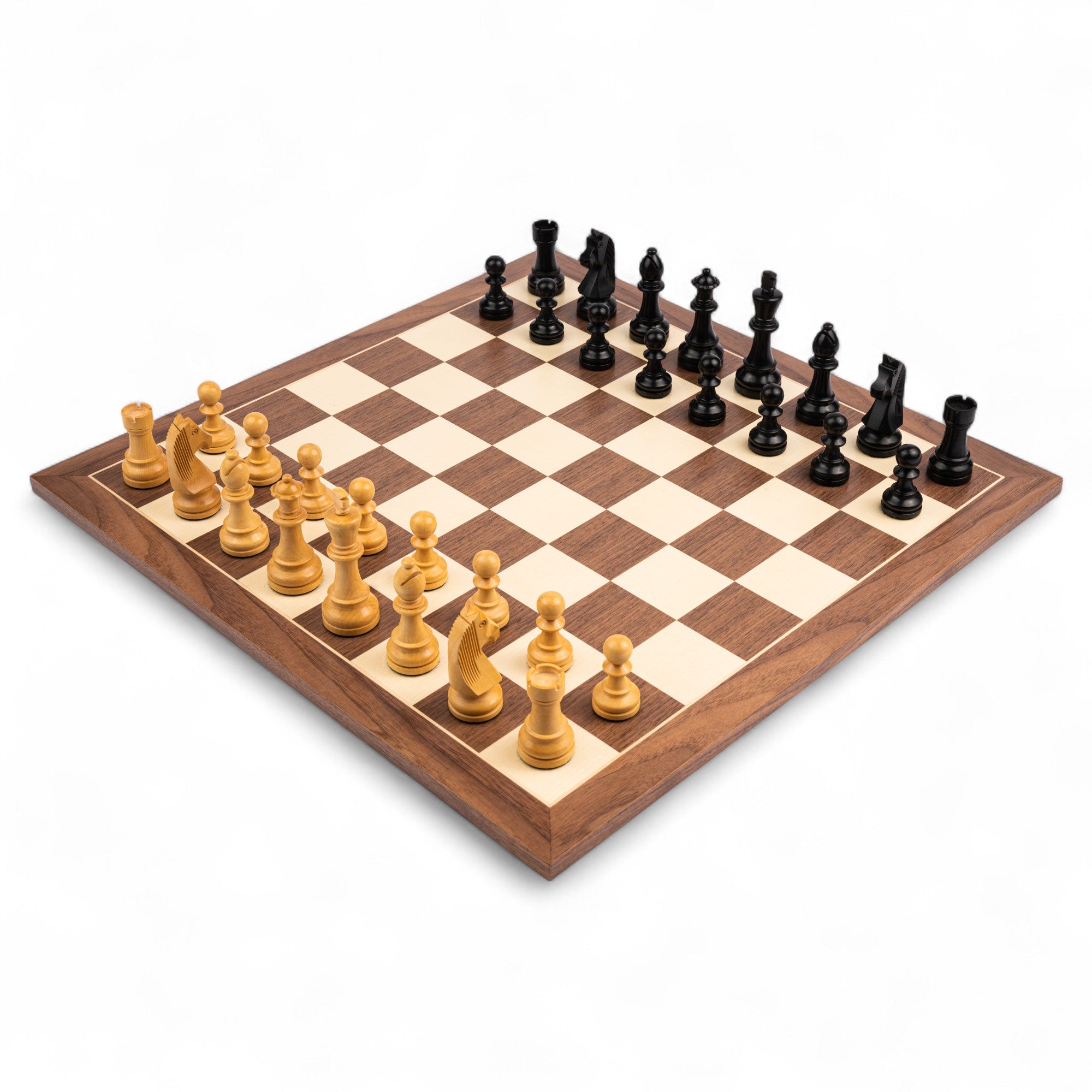 Wooden chessboard with black and white pieces on a white background