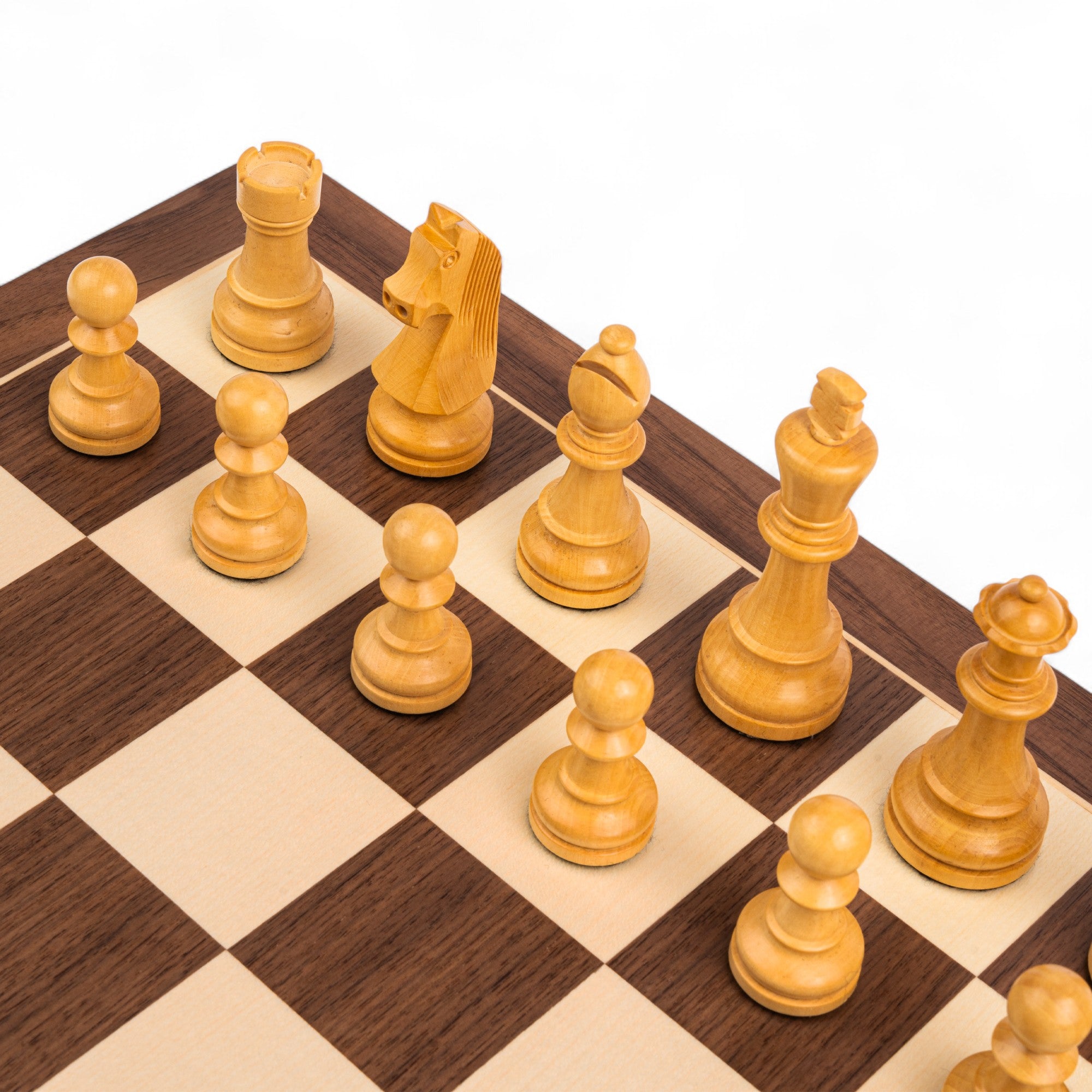 Wooden chess pieces on a wooden chessboard