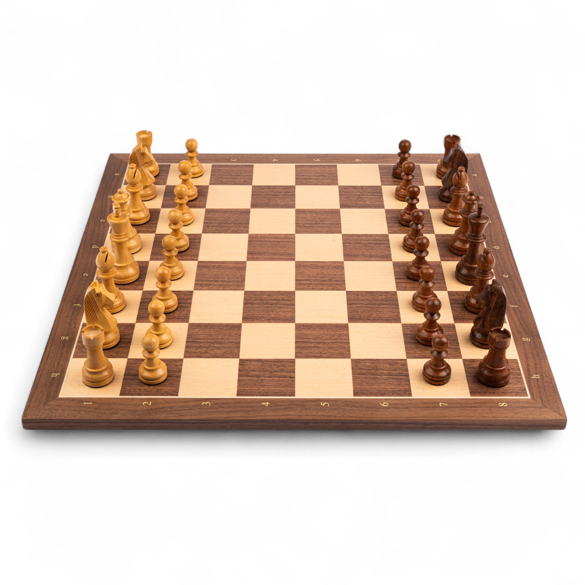 Wooden chessboard with pieces on a white background