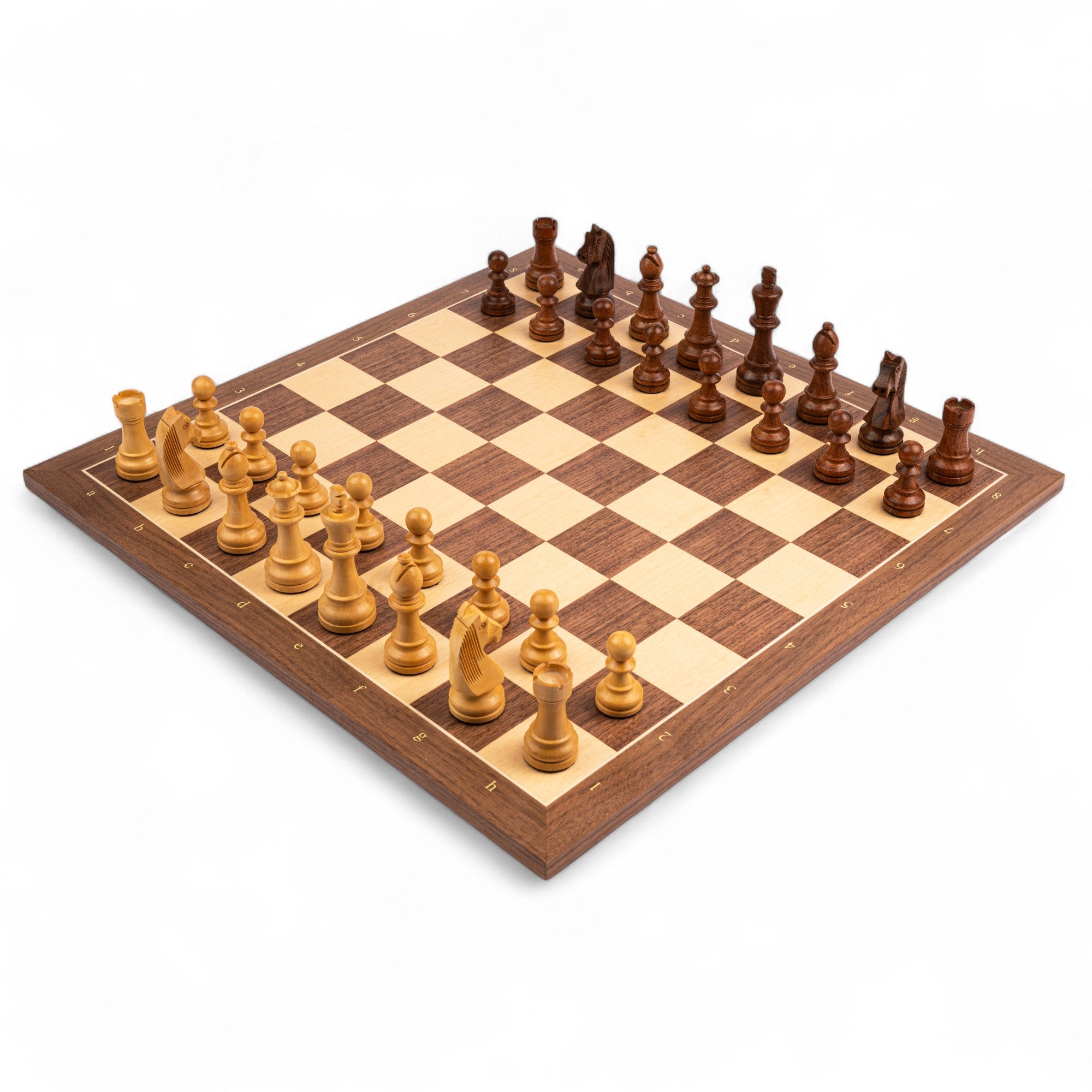 Wooden chessboard with pieces on a white background
