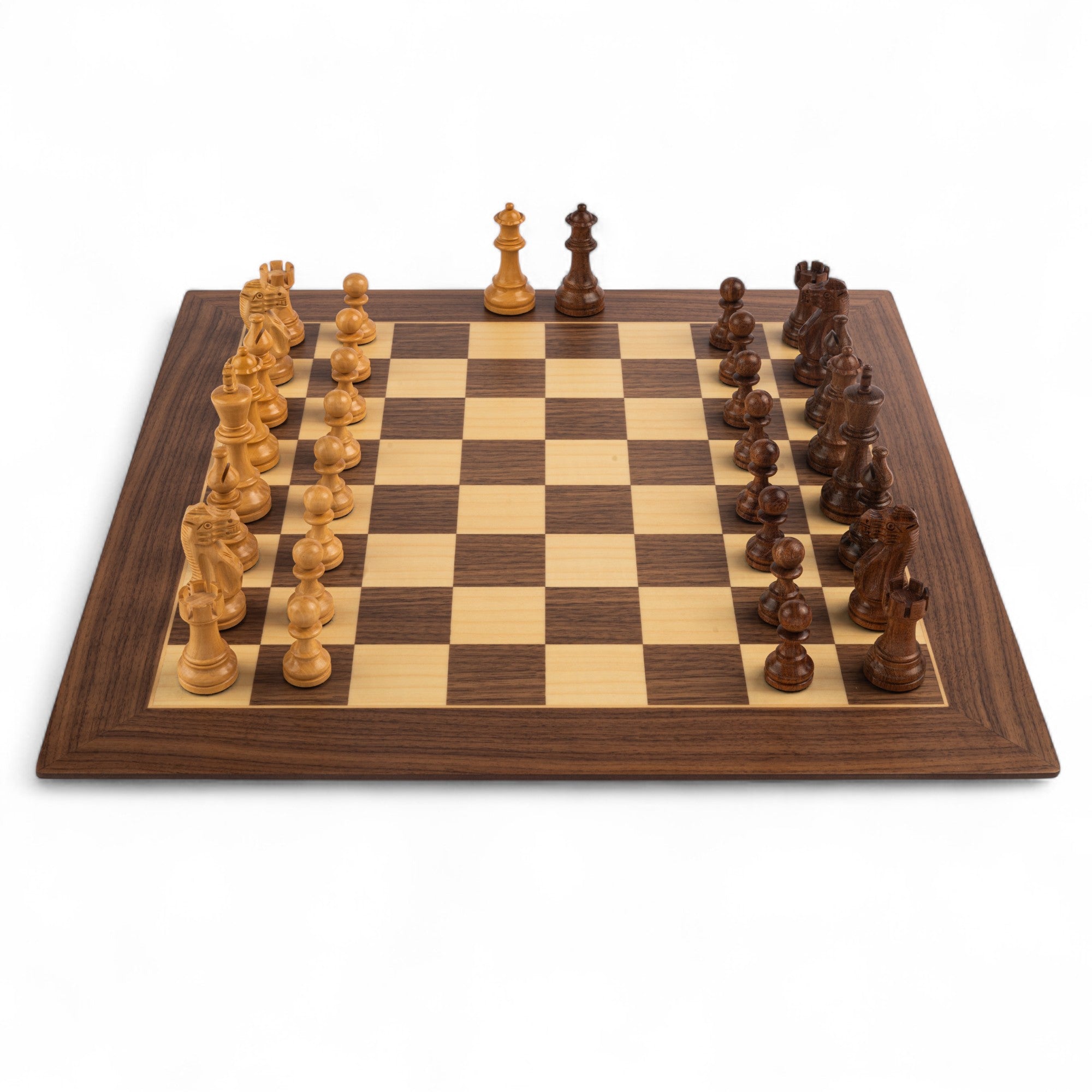 Wooden chessboard with pieces on a white background